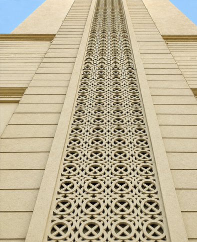 Modern building facade with geometric GRC jali panel cladding for ventilation and design