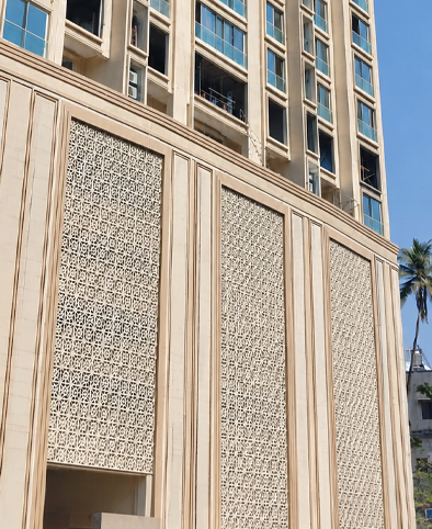 Modern building facade with geometric UHPC jali panel cladding for ventilation and design